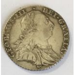 A GEORGE III SHILLING. A George III Shilling dated 1787.