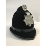 A DORSET POLICE HELMET. A Dorset Police officers 'Custodian' helmet, size 58.