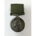 A VOLUNTEER LONG SERVICE MEDAL. A Victorian Long Service Medal 'Victoria Regina', named to