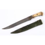 AN EASTERN DAGGER AND SCABBARD. An Eastern dagger with a 26cm bowie type blade with double edged