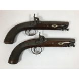 A PAIR OF PERCUSSION CAP PISTOLD BY MOORE OF LONDON. A pair of single barrel percussion back