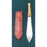 AN AFRICAN TRIBAL KNIFE. An African hunting knife with broad flat double edged 17cm blade with a