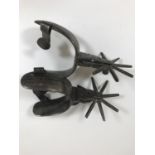 A PAIR OF AMERICAN WESTERN TYPE SPURS. Each with allover engraved decoration, scrolling and