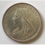 A VICTORIAN SHILLING. A Victorian shilling, dated 1893, old veiled bust.