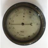 A SUBMARINE PRESSURE GAUGE AND U.S. LOAD ADJUSTER. A circular pressure gauge dial calibrated in