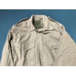 A COLLECTION OF MILITARY SHIRTS, TROUSERS AND OTHER ITEMS. A collection of military uniform, the