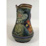 A DOULTON LAMBETH 'FLAG OF PRETORIA' JUG. A Doulton Lambeth stoneware jug dated June 5th 1900 with a