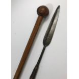 A ZULU SPEAR AND A WOODEN KNOB KERRIE. The spear pointed leaf shaped tip bound to a patinated shaft,