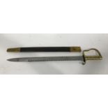 A WILKINS OF LONDON 1856 PATTERN PIONEER SWORD AND SCABBARD. The 57cm pointed blade with saw edge,