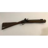 AN IRON BARREL BLUNDERBUSS. An iron barrel flintlock blunderbuss with slightly flared barrel,