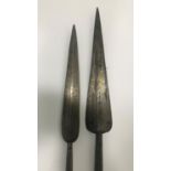 TWO AFRICAN STYLE THROWING SPEARS. Two African style double ended spears with shaped points and
