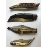 A SPANISH STYLE FOLDING KNIFE AND THREE OTHERS. A Spanish style folding knife with a 10cm shaped and