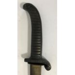 AN UNUSUAL SWORD WITH CAST IRON HANDLE. A sword with a curving 77cm blade with allover scrolling and