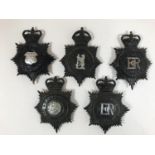 A COLLECTION OF POLICE HELMET PLATES AND BUTTONS. A Warwickshire Constabulary helmet plate with