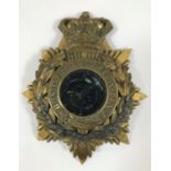 A DURHAM LIGHT INFANTRY HELMET PLATE. An officers Durham Light Infantry helmet plate with