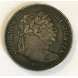 A GEORGE III HALFCROWN. A George III Hlafcrown, 'bulls head' portrait, dated 1817.