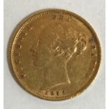 A VICTORIAN 'YOUNG HEAD' HALF SOVEREIGN. A Victorian 'Young Head' Half Sovereign dated 1872 and with