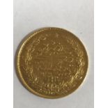 A TURKISH 100 KURUSH COIN. A Gold 100 Kurush coin bearing an Arabic date of 1293. 7.1g.