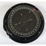 A SECOND WORLD WAR AEROPLANE COMPASS. A Type P8 compass with stamped No. 87309 H. 14cm wide.