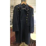 A RUSSIAN GREATCOAT. A modern Russian greatcoat with brass star buttons, a patch to the left arm and