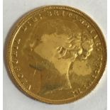 A VICTORIAN 'YOUNG HEAD' SOVEREIGN. A Victorian 'Young Head' Sovereign dated 1871.