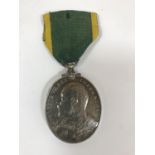 A TERRITORIAL FORCE EFFICIENCY MEDAL. An Edward VII Territorial Force Efficiency Medal named to 69