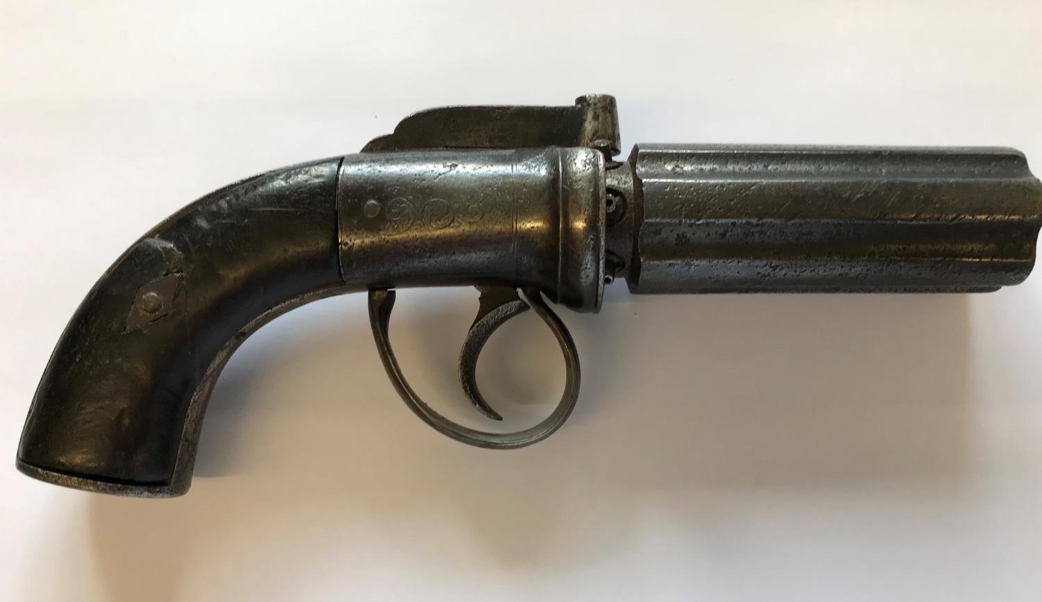 A PEPPER BOX TYPE REVOLVER. An English Six Barel Pepper Box type revolver with a rotating 8cm barrel