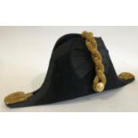 ROYAL NAVY OFFICERS BICORN CAP. A Naval Officers dress bicorn hat in 'Tiger effect' tin case,