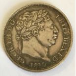 A GEORGE III SHILLING. A George III Shilling dated 1819.