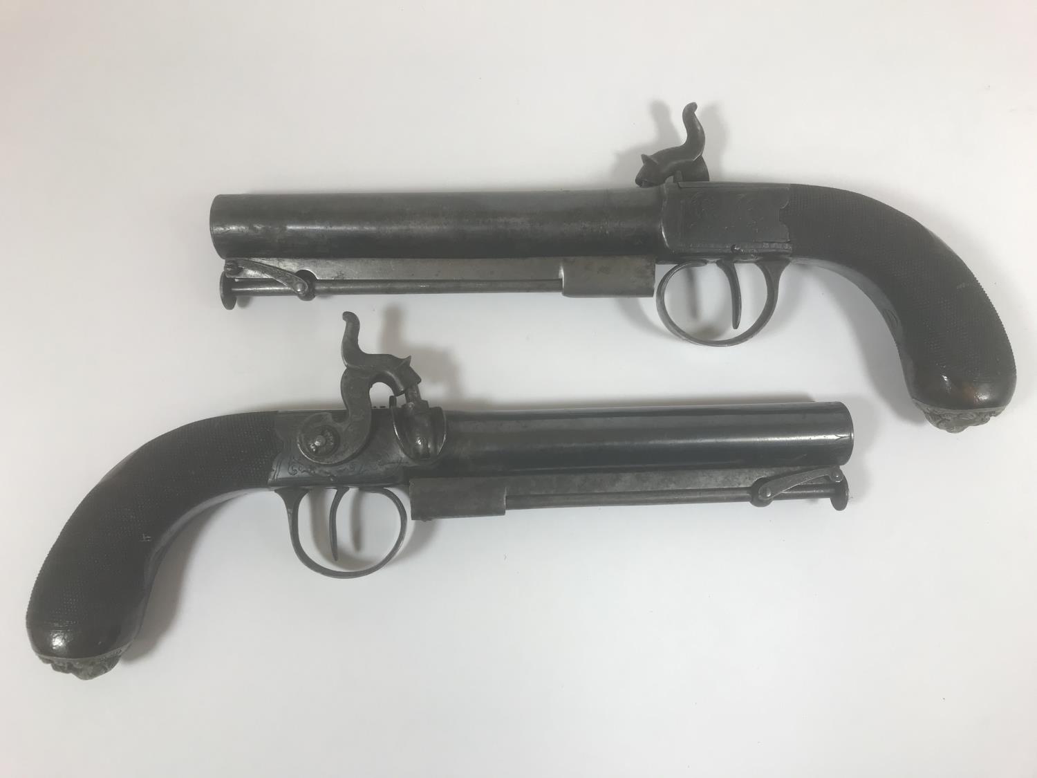 A PAIR OF BOX LOCK PISTOLS AND A POCKET PISTOL. A pair of box lock side hammer percussion cap pocket