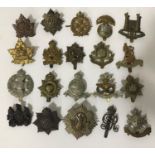A LARGE COLLECTION OF REGIMENTAL AND SIMILAR CAP BADGES. A collection of 48 regimental cap badges