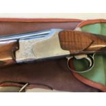 A WINCHESTER OVER AND UNDER 12 BORE SHOTGUN. A Winchester 6500 Skeet 126A - 70mm 12 Bore Ejector