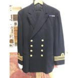 A ROYAL NAVY RESERVE OFFICERS JACKET AND TROUSERS. A Lieutenant Commander, reserves, officers No. 1c