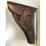 A SECOND WORLD WAR PERIOD LEATHER PISTOL HOLSTER. A leather holster stamped 33 1941 CA867 (?).