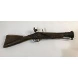 A REPRODUCTION SHORT BARRELED BLUNDERBUSS. A flintlock blunderbuss with short flared barrel with