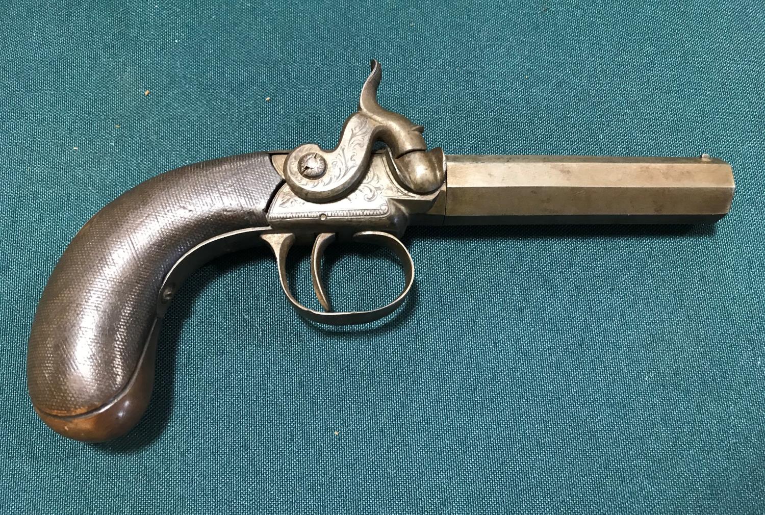 A POCKET PISTOL BY EGAN OF BRADFORD. A 19th century 50 bore percussion pocket pistol with a 7.5cm