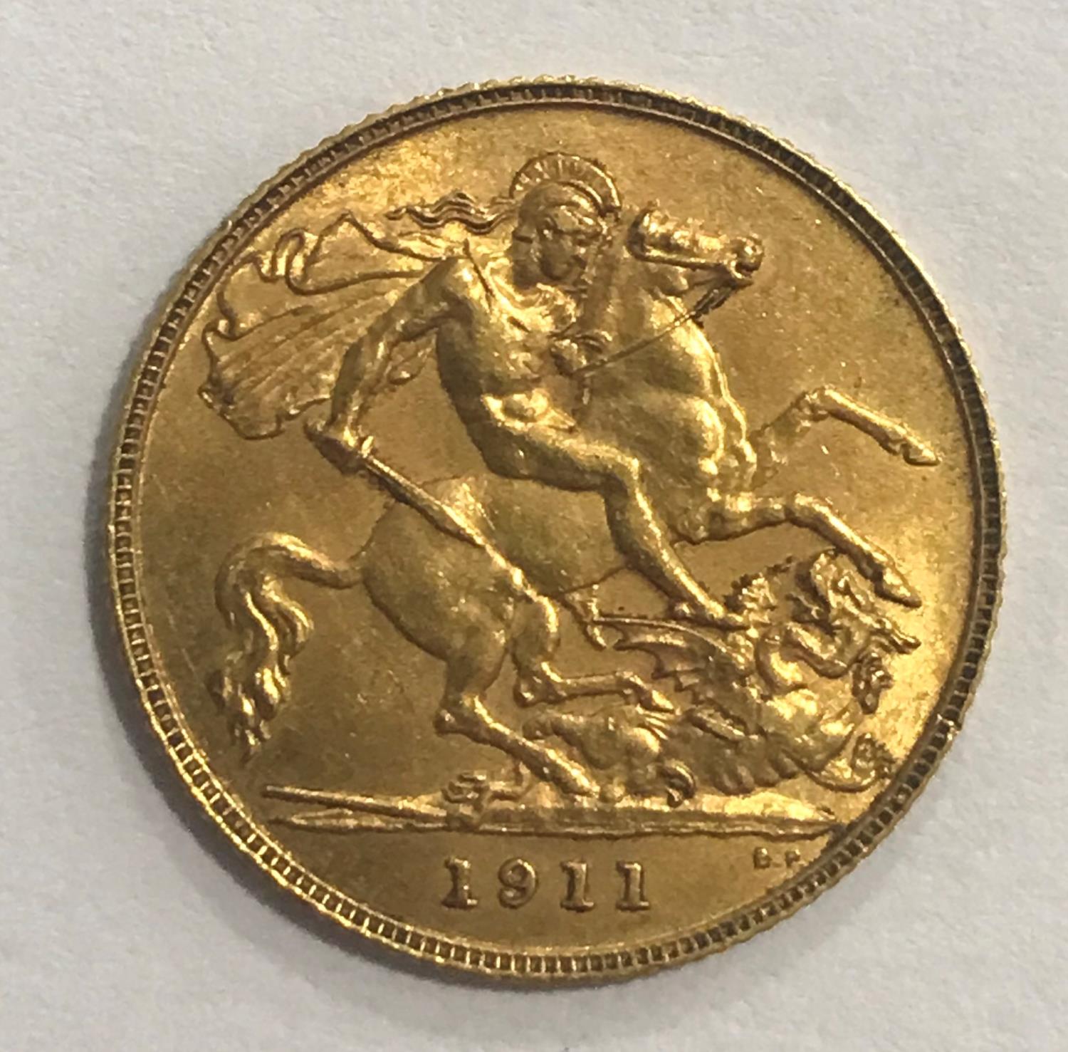A HALF SOVEREIGN. A George V half Sovereign dated 1911. - Image 2 of 2
