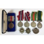 A GROUP OF SECOND WORLD WAR MEDALS TO THE DEVON REGIMENT. A Collection of Second World War and later