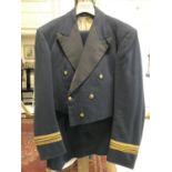 AN RAF OFFICERS MESS JACKET, WAISTCOAT, TROUSERS AND CAP. A Squadron Leaders Mess Jacket by Moss