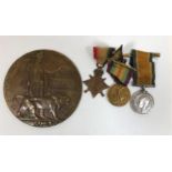 A GREAT WAR TRIO AND MEMORIAL PLAQUE TO A MEMBER OF THE ROYAL SCOTS. A First World War trio named to