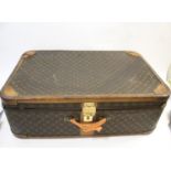 MODERN LOUIS VUITTON SUITCASE with a monogrammed exterior and leather trim, with a combination