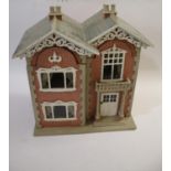 DOLLS HOUSE a 20thc dolls house with brick facade, the 2 storey house with glazed windows and