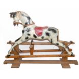 HADDON ROCKING HORSE a large fibreglass rocking horse, fitted with a saddle and bridle and mounted