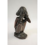 TRIBAL FIGURE - BALI, 1938 a carved hardwood figure of a lady, the figure in a seated pose and