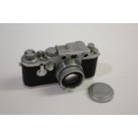 LEICA CASED CAMERA a Leica IIIf rangefinder camera, Serial Number 687691 (1954) and with a Leitz