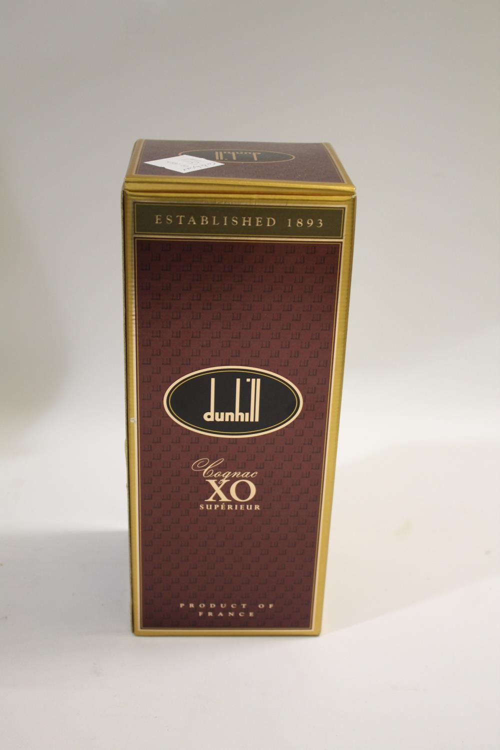 COGNAC: Dunhill XO Superieur, Bottle number 083840, in a faceted decanter and stopper, with original