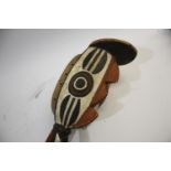 BURKINA FASO TRIBAL MASK a large painted tribal mask with Bird style head and curved body. 107cms