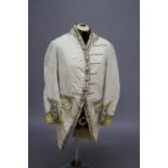 19THC FOOTMANS UNIFORM a 19thc cream wool footman's uniform, trimmed with silver metallic braid