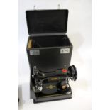 SINGER SEWING MACHINE - 221K a folding portable Singer 221K sewing machine, in its case and with