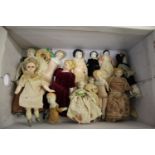 MINIATURE DOLLS including an unusual small wax head doll with glass eyes and composition limbs (